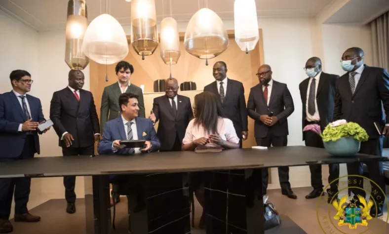 Mr Sunder Kithani, the finance director of Stellar Holding and Dr Agnes Adu, the chief executive officer of the Ghana Trade Fair Company, signing the agreement. Looking on is President Akufo-Addo